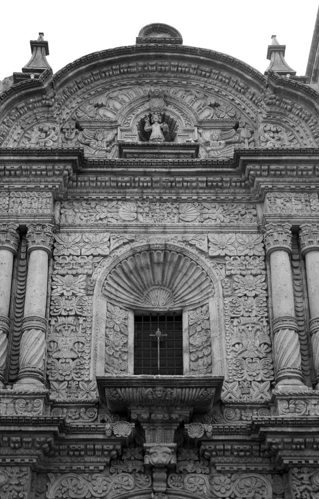 Intricate Baroque facade with carved volcanic stone details in Arequipa, Peru.